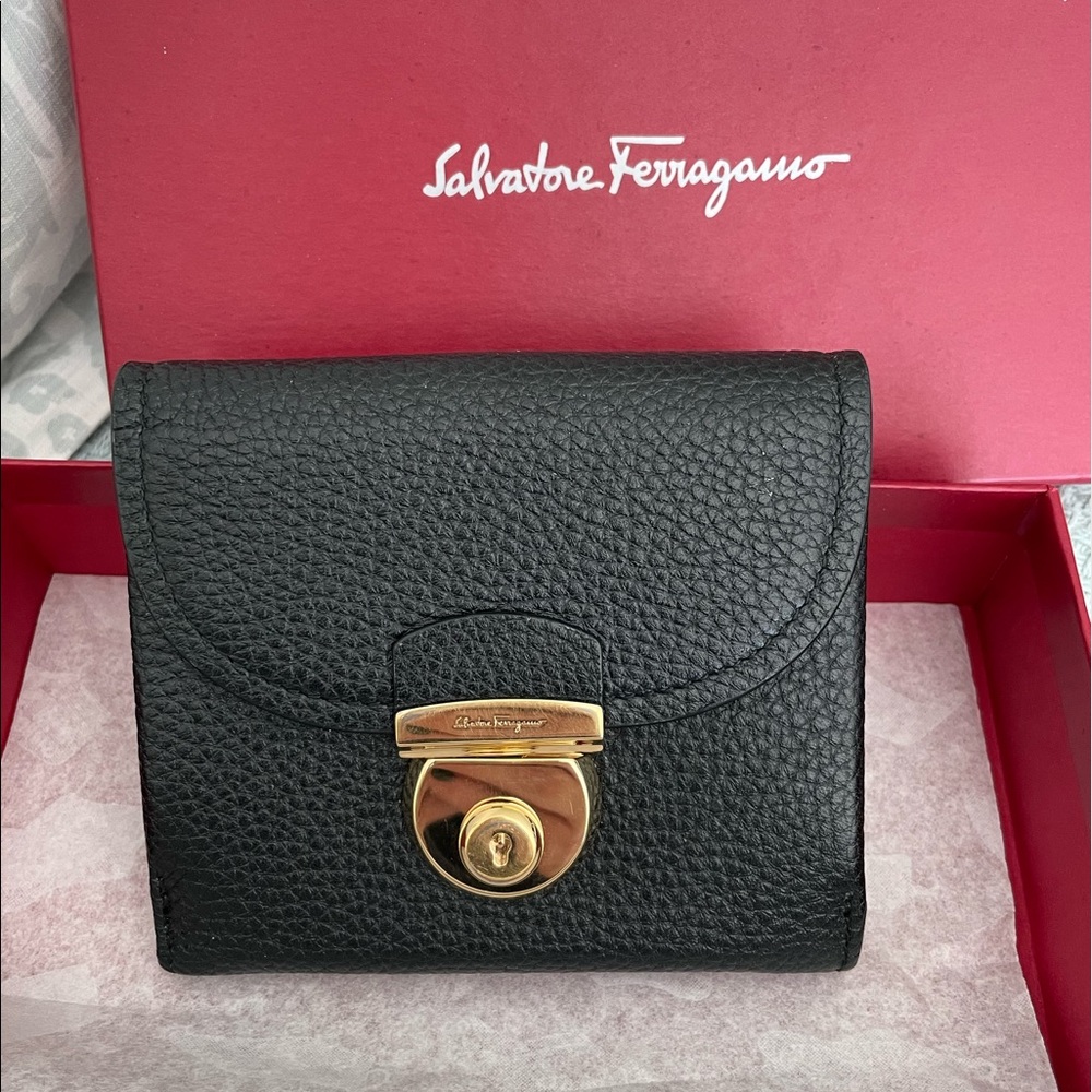 Salvatore Ferragamo black grain leather wallet w/gold tone push-lock hardware